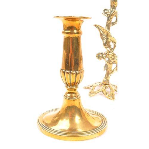 204 - A collection of four pairs of early 20th century brass candlesticks. Mostly Art Nouveau style, with ... 