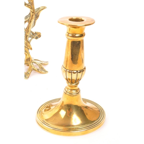 204 - A collection of four pairs of early 20th century brass candlesticks. Mostly Art Nouveau style, with ... 