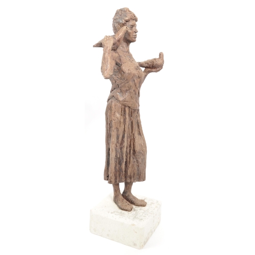 206 - A vintage 20th century sculpture of a woman with a dove on one shoulder, another in her hand. On a w... 