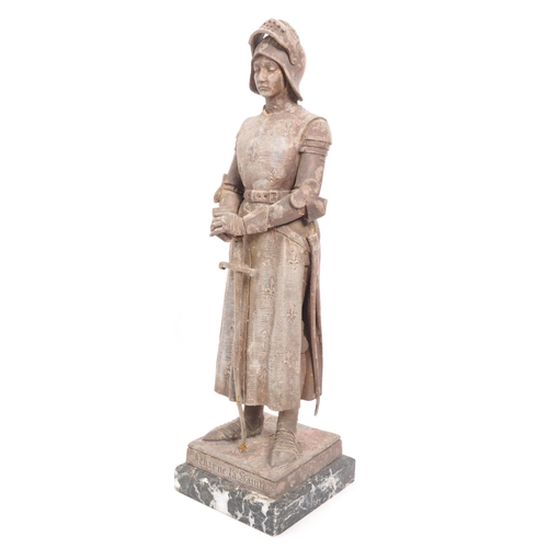 207 - An early 20th century cast metal figure / statue of Joan of Arc. Standing upright with Knight's armo... 