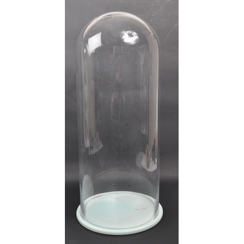 210 - Two large contemporary glass dome display cases. With circular bases.(51cm height approx.)... 