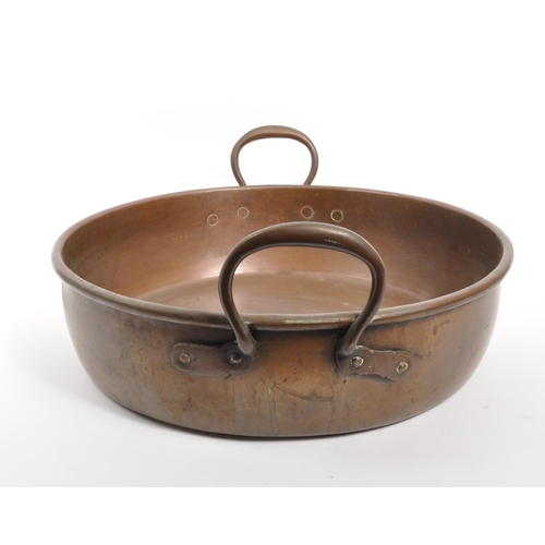 211 - A large 19th century Victorian copper jam / preserving pan. The pan of rounded form, having a falt b... 