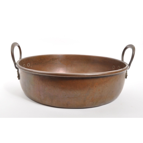 211 - A large 19th century Victorian copper jam / preserving pan. The pan of rounded form, having a falt b... 