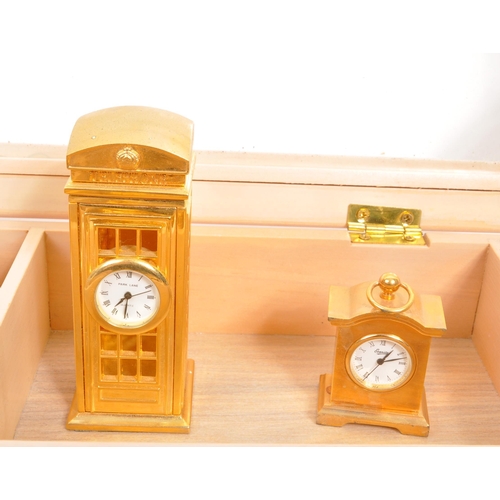 212 - A collection of twelve of miniature novelty clocks by various manufacturers to include Wellington, E... 