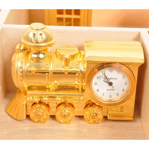 212 - A collection of twelve of miniature novelty clocks by various manufacturers to include Wellington, E... 