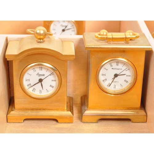 212 - A collection of twelve of miniature novelty clocks by various manufacturers to include Wellington, E... 