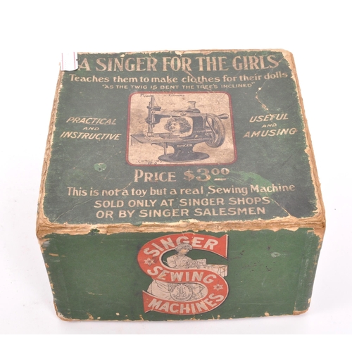 213 - Singer - An early 20th Century miniature Singer sewing machine ' A Singer for the Girls ' in origina... 