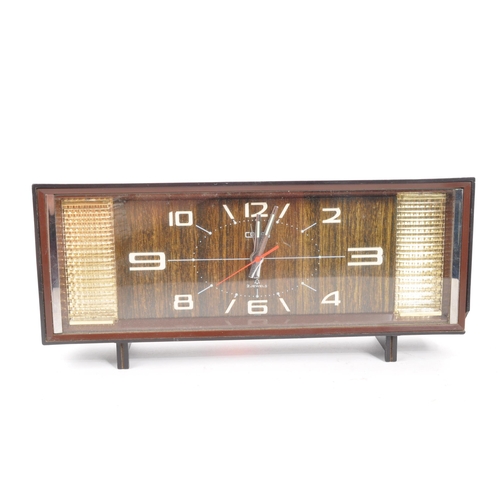 220 - Coral - A mid Century circa 1950s / 60s retro Coral clock of rectangular form with arabic numbers an... 