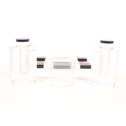 221 - An early 20th century mid Art Deco 1920s - 1930s table cruet set. The set of black and lucite form f... 