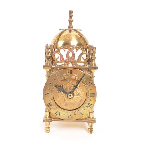 223 - Smiths - A vintage mid 20th century brass lantern mantel clock. With later battery operated movement... 