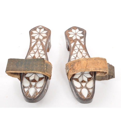 226 - A pair of early 20th century Turkish Ottoman mother of pearl inlaid bath shoes / clogs. The clogs ea... 