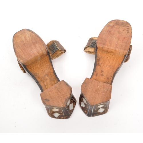 226 - A pair of early 20th century Turkish Ottoman mother of pearl inlaid bath shoes / clogs. The clogs ea... 