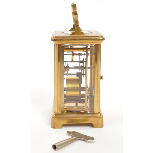 227 - Mappin Brothers - Early 20th century French brass carriage / mantel clock. Carry handle to top, whit... 