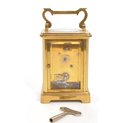 227 - Mappin Brothers - Early 20th century French brass carriage / mantel clock. Carry handle to top, whit... 