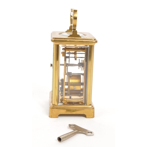 227 - Mappin Brothers - Early 20th century French brass carriage / mantel clock. Carry handle to top, whit... 