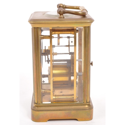 229 - Wordley & Co - An early 20th century Paris, France brass carriage clock. With carry handle to to... 