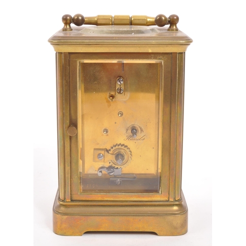 229 - Wordley & Co - An early 20th century Paris, France brass carriage clock. With carry handle to to... 