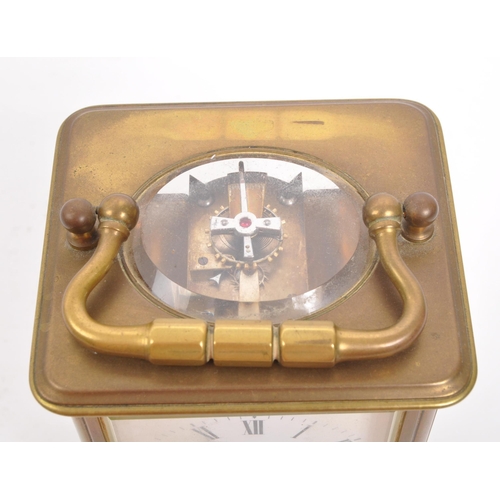 229 - Wordley & Co - An early 20th century Paris, France brass carriage clock. With carry handle to to... 