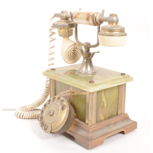 230 - A 20th Century vintage onyx telephone with metal rotary dial and cord to handset. The base of rectan... 