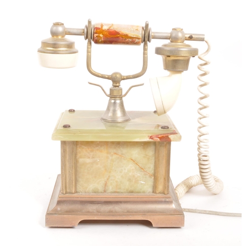 230 - A 20th Century vintage onyx telephone with metal rotary dial and cord to handset. The base of rectan... 