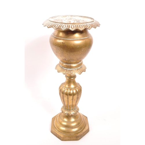 232 - A 20th century brass jardiniere plant stand. The stand having a stepped base, with gadrooned relief ... 