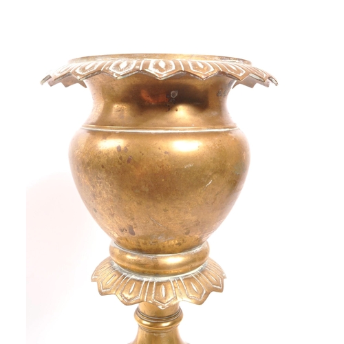 232 - A 20th century brass jardiniere plant stand. The stand having a stepped base, with gadrooned relief ... 