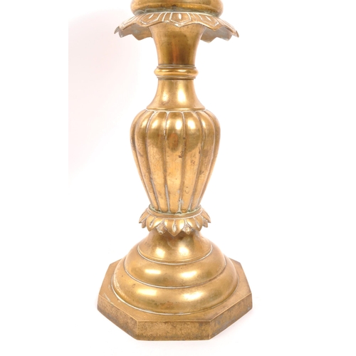 232 - A 20th century brass jardiniere plant stand. The stand having a stepped base, with gadrooned relief ... 