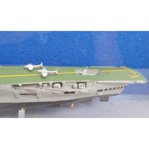 233 - H. M. S. Victorious - A vintage 20th century handmade model aircraft carrier vessel boat. In a glass... 