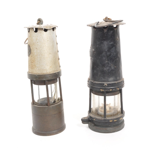 238 - J. H. Naylor Ltd - Two vintage 20th century miners' safety lamps / lights. Both with hanging hooks t... 