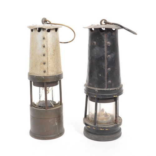 238 - J. H. Naylor Ltd - Two vintage 20th century miners' safety lamps / lights. Both with hanging hooks t... 