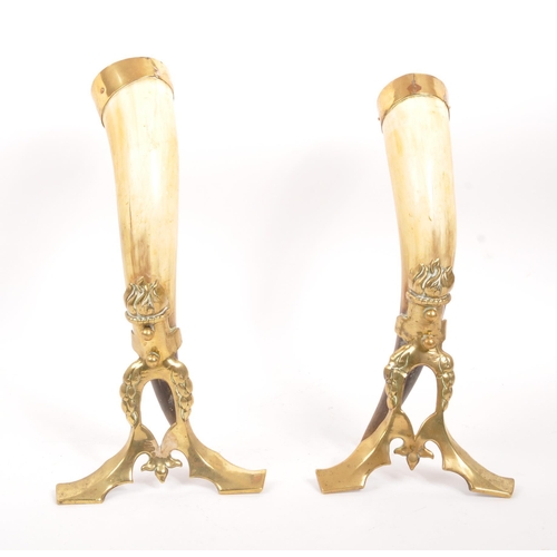 255 - A pair of 19th century horn & brass mounted cornucopia table decorations. Each having a brass mo... 