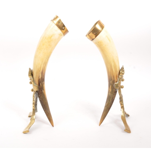 255 - A pair of 19th century horn & brass mounted cornucopia table decorations. Each having a brass mo... 