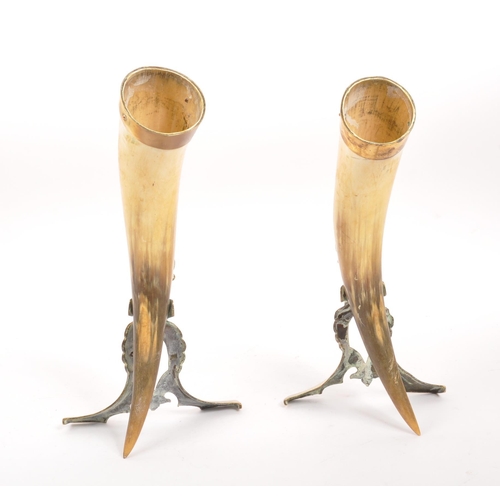 255 - A pair of 19th century horn & brass mounted cornucopia table decorations. Each having a brass mo... 