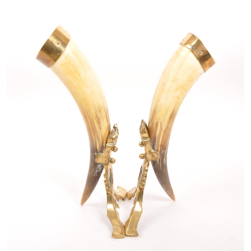 255 - A pair of 19th century horn & brass mounted cornucopia table decorations. Each having a brass mo... 