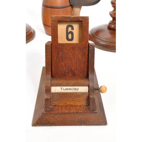 258 - A vintage collection of treen items. To include three pairs of wooden turned mahogany candlestick ho... 