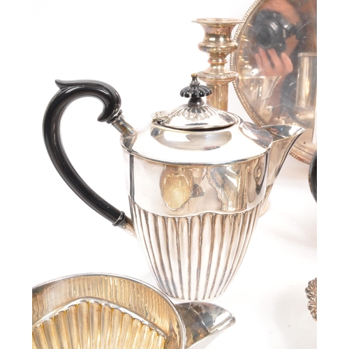 259 - A collection of vintage 20th century silver plated items. Including teapots, entree dishes, flasks, ... 