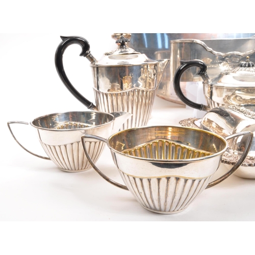 259 - A collection of vintage 20th century silver plated items. Including teapots, entree dishes, flasks, ... 