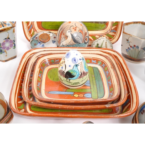 26 - A large collection of 20th century Mexican ceramic pottery items. The collection to include decorati... 