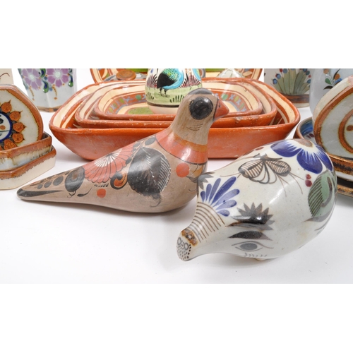 26 - A large collection of 20th century Mexican ceramic pottery items. The collection to include decorati... 