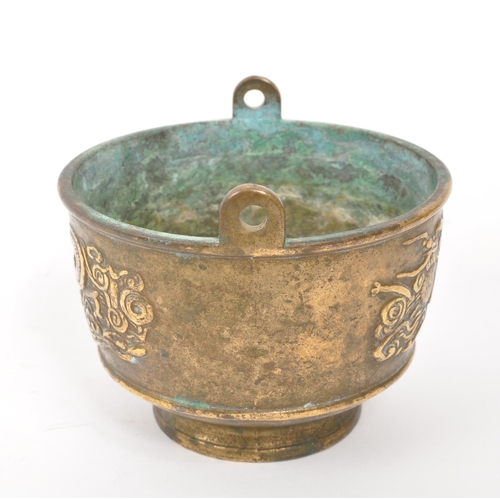 263 - A 19th Century brass censer / scent bowl of circular form with dragon relief design to body. (6.5cm ... 