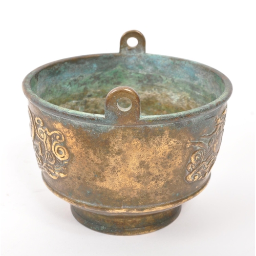 263 - A 19th Century brass censer / scent bowl of circular form with dragon relief design to body. (6.5cm ... 