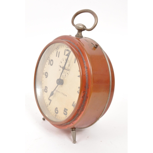 265 - A mid 20th century Kienzle Tam Tam alarm clock. The alarm clock of rounded and metal construction, w... 