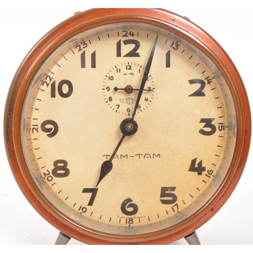 265 - A mid 20th century Kienzle Tam Tam alarm clock. The alarm clock of rounded and metal construction, w... 