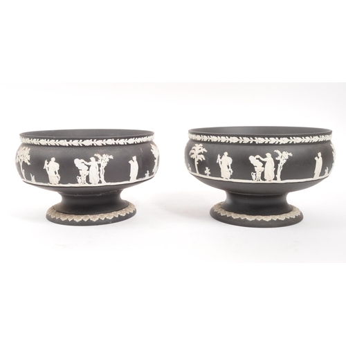 27 - Wedgwood - A pair of 20th Century ceramic Wedgwood black basalt Jasperware pedestal bowls featuring ... 