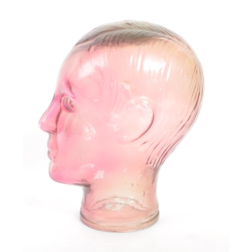 274 - A vintage 20th century pressed purple glass milliners / phrenology type head bust having moulded fac... 