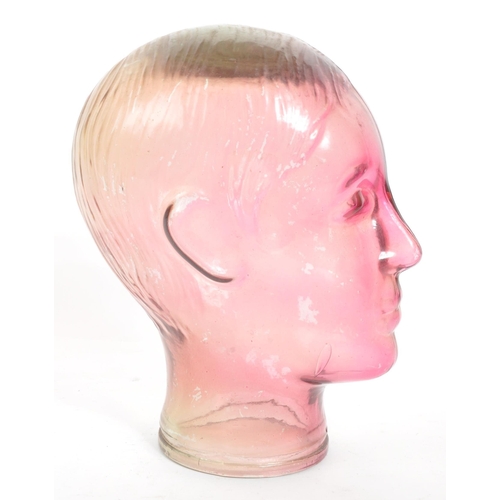 274 - A vintage 20th century pressed purple glass milliners / phrenology type head bust having moulded fac... 