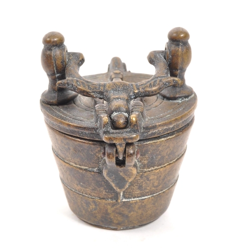 278 - An 18th Century Nuremberg bronze apothecary scale weight set. With three ' cups ' within of graduati... 