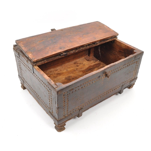 279 - A 17th Century Indian hand carved sandalwood dowry box / chest with folding lid and long iron hinges... 