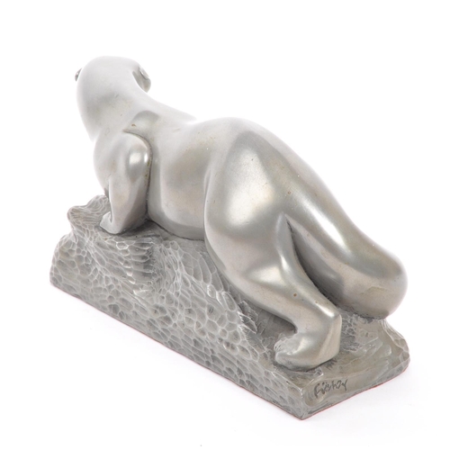 281 - The Fisher Collection -  A contemporary pewter style otter figurine by Richard Fisher on naturalisti... 