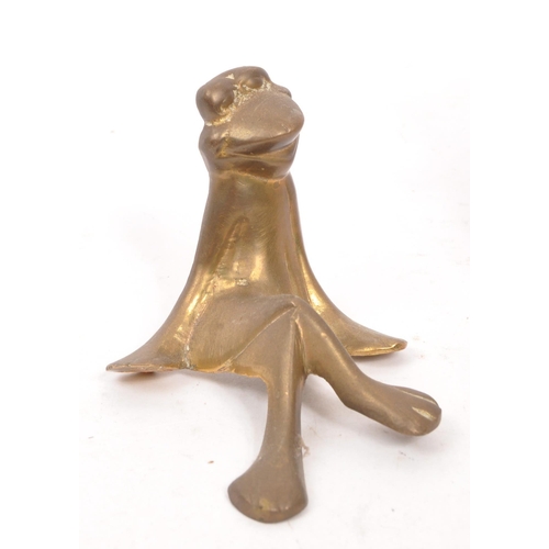 284 - A collection of vintage 20th century brass frogs and trinket box fly. Frog ornament crossed legged i... 